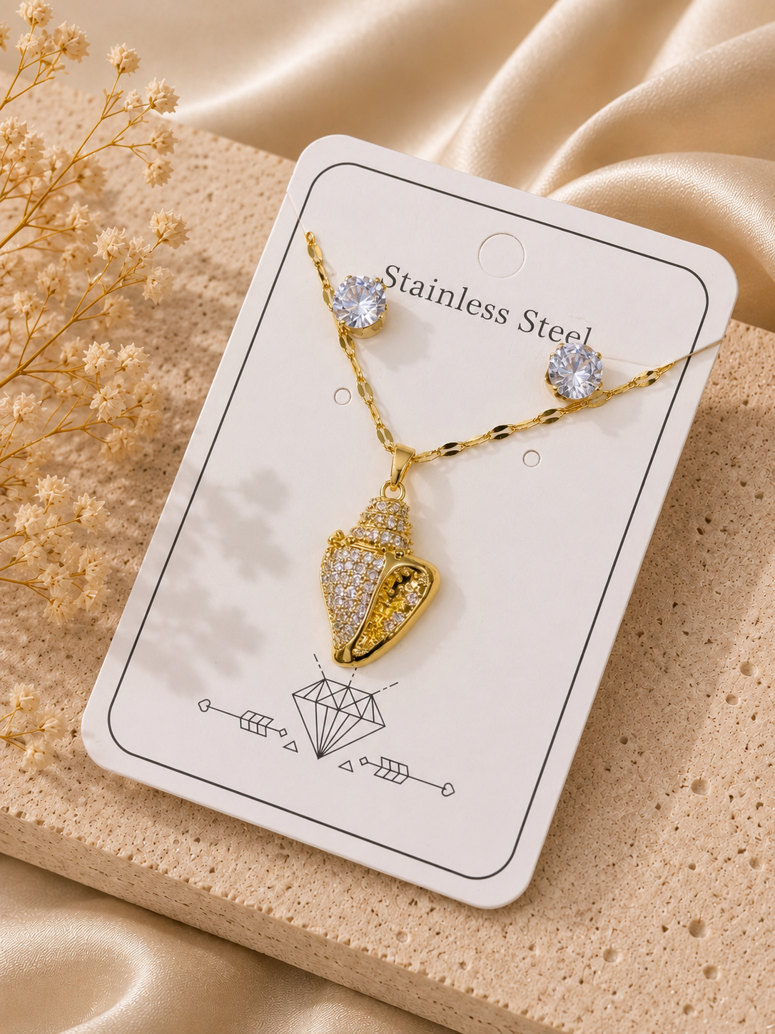 Conjunto caracol de mar con cristales acero inoxidable