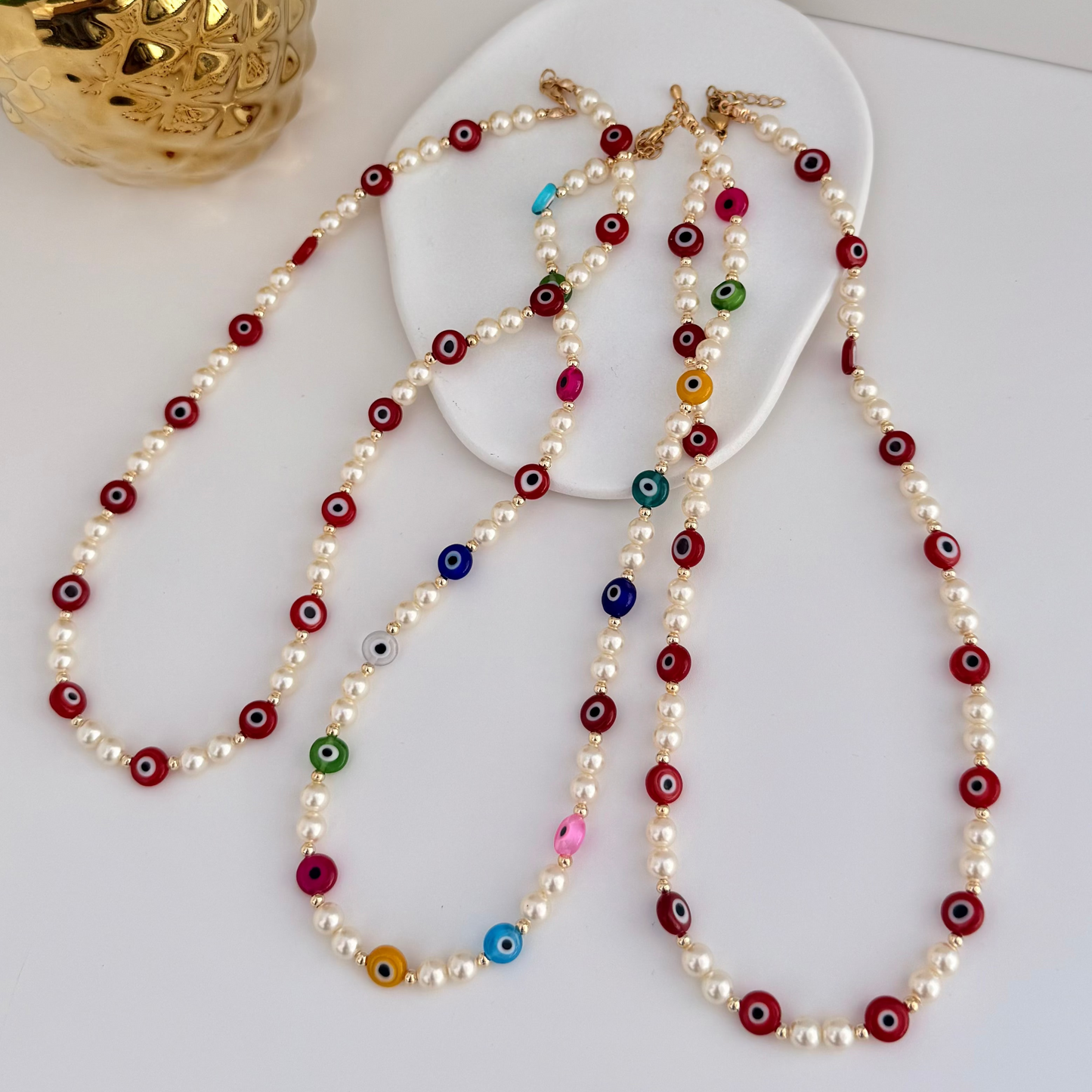 Collares perlas naturales ojos turcos