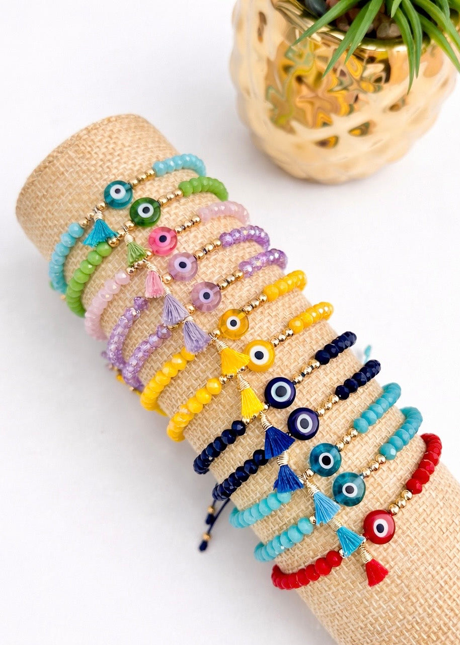 Pulsera ajustable de hilo con ojo turco y pompón