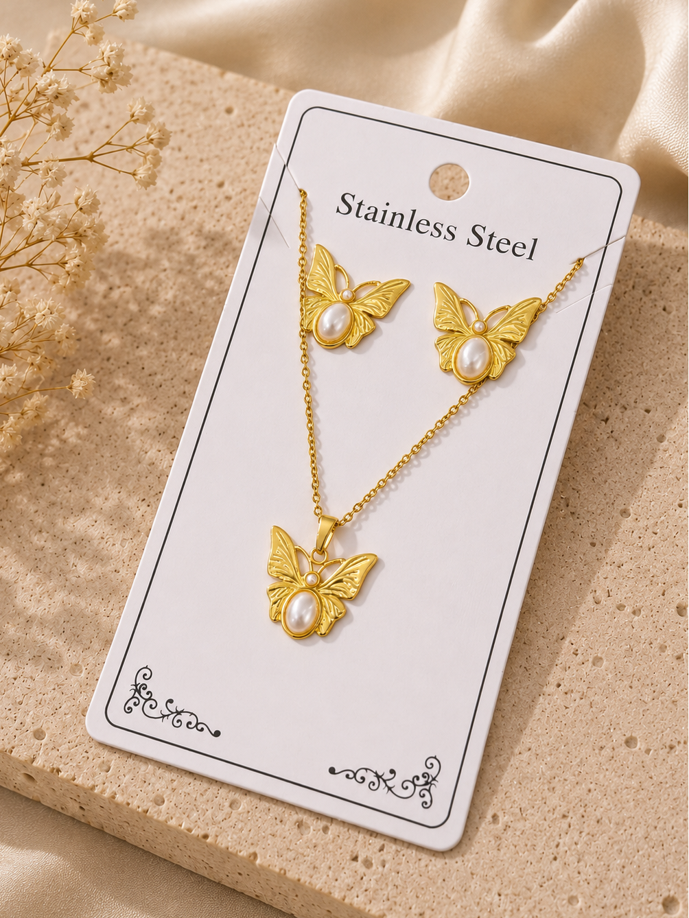 Conjunto mariposa con perla acero inoxidable