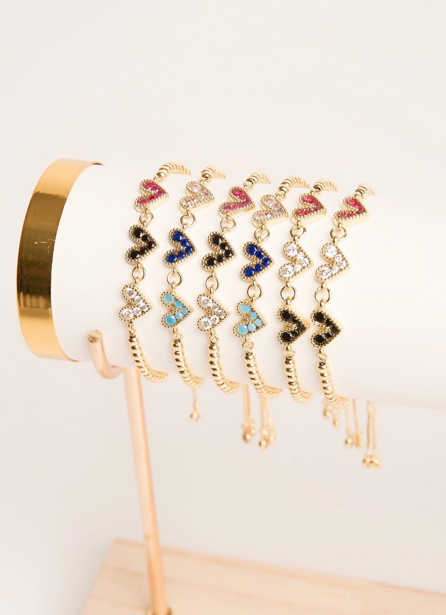 Pulseras tres corazones multicolor chapa de oro.
